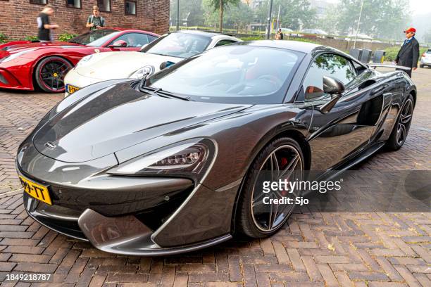 mclaren 570s sports car parked on a street - mclaren 570s stock pictures, royalty-free photos & images