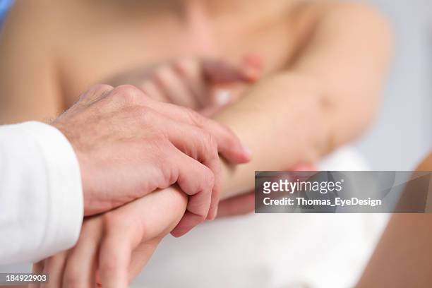 professional doctor examining arm of a patient. - examining hair stock pictures, royalty-free photos & images