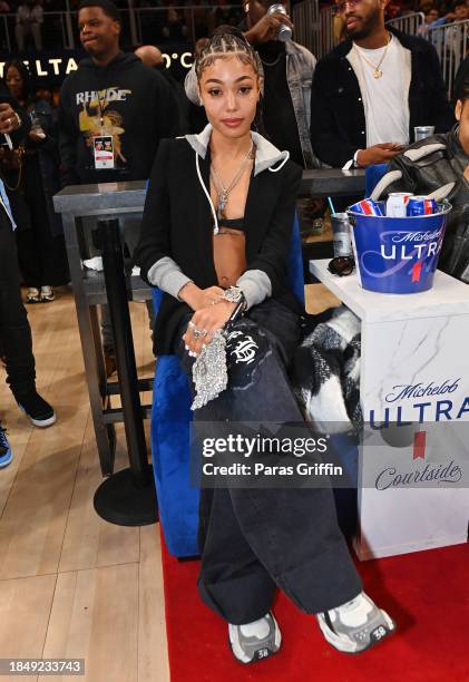 Rapper Coi Leray attends the game between the Denver Nuggets and the Atlanta Hawks at State Farm Arena on December 11, 2023 in Atlanta, Georgia. NOTE...