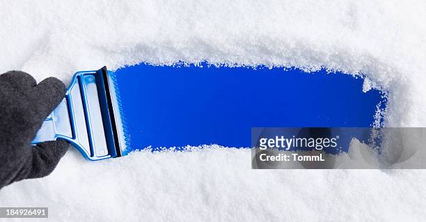 ice scraper on window - winter car window stock pictures, royalty-free photos & images