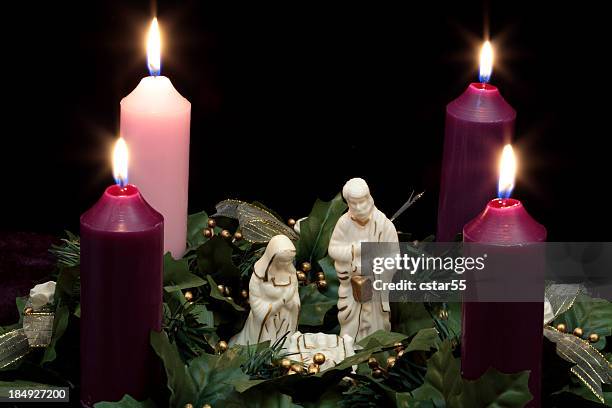 religious: christmas advent wreath with nativity scene 2 - catholic church christmas stock pictures, royalty-free photos & images
