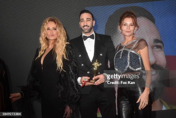 Adriana Karembeu, Adil Rami and Lola Karimova attend the 46th "The Bests" Gala at Four Seasons Hotel on December 11, 2023 in Paris, France.