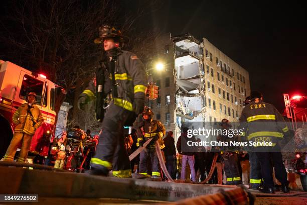 Firefighters work at the site of a partially collapsed residential building on December 11, 2023 in New York City. Part of a seven-story residential...