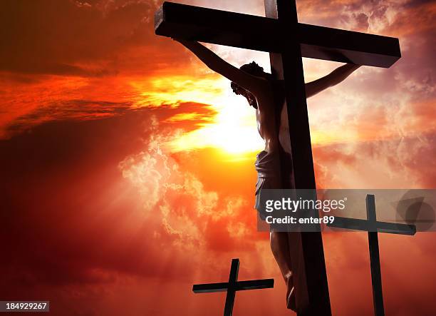 jesus christ crucified on the cross - jesus christ stock pictures, royalty-free photos & images