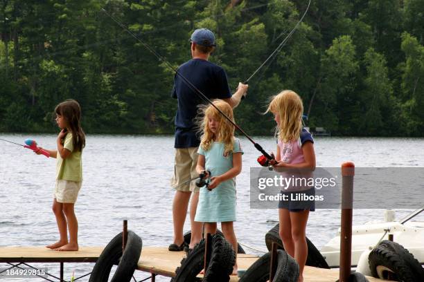 daddy fishin' with his girls! - kids fishing stock pictures, royalty-free photos & images