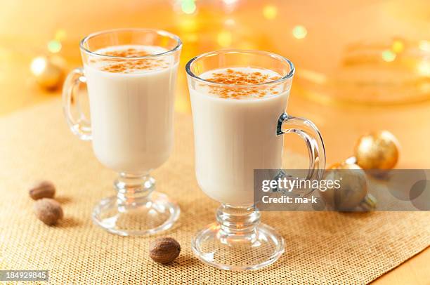 two large glasses of eggnog served beautifully - eggnog stock pictures, royalty-free photos & images