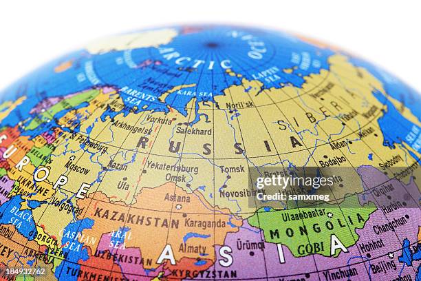 a globe showing russia with a white background - russia world stock pictures, royalty-free photos & images