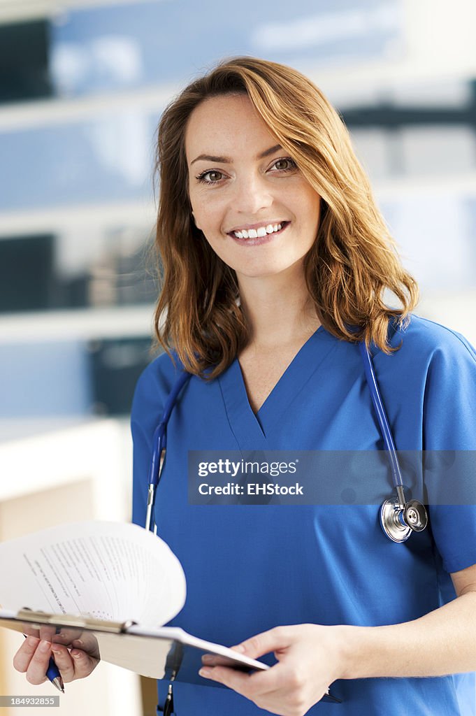 Young Woman Doctor Nurse in Office