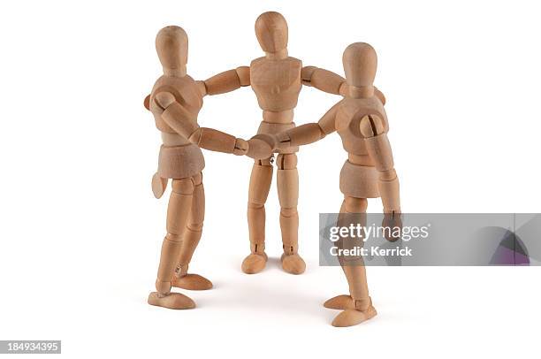 wooden dools holding hands and talking - clashes stock pictures, royalty-free photos & images