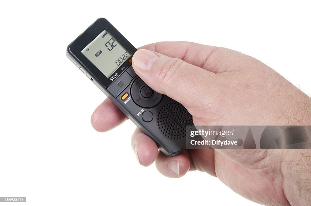 Mans Hand Holding Digital Voice Recorder