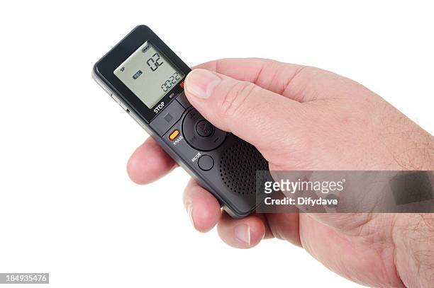 mans hand holding digital voice recorder - digital recorder stock pictures, royalty-free photos & images