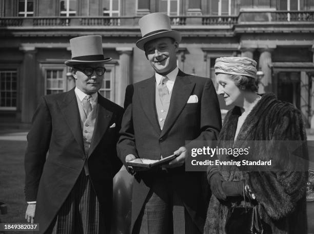 British speed record breaker Donald Campbell posing outside Buckingham Palace after being made a CBE at an investiture ceremony, London, March 26th...