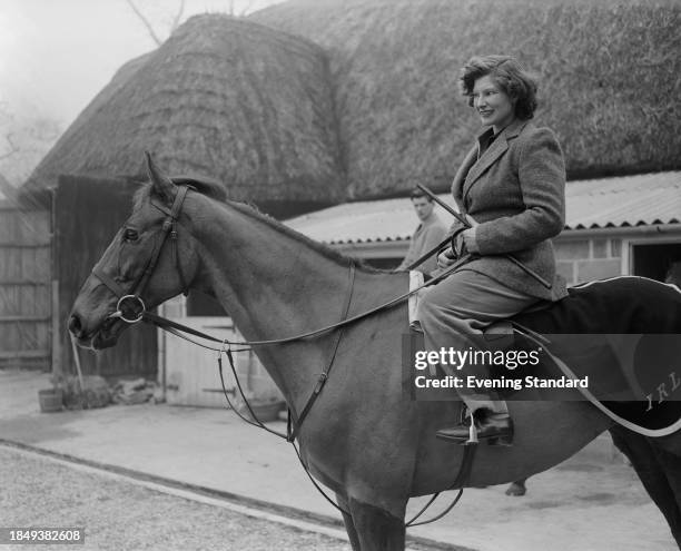 British jockey and horse trainer Rosemary Lomax on racehorse Hart Royal at racing stables in Baydon, Wiltshire, March 11th 1957. Lomax was Britain's...