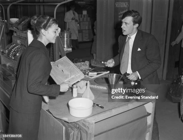 British interior designer Terence Conran and his wife, artist Shirley Conran, viewing kitchenware at Selfridges department store in London, May 24th...