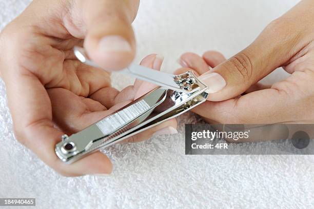cutting nails, nail clipper (xxxl) - fingernail stockfoto's en -beelden