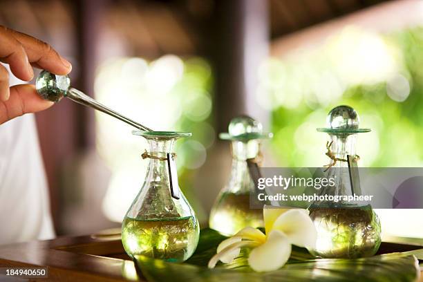 massage oil - essence day stock pictures, royalty-free photos & images