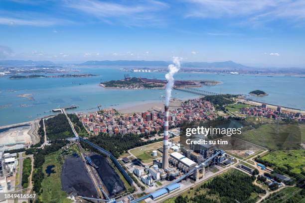 a coal power plant by the seaside on a sunny day - carbon cycle stock pictures, royalty-free photos & images