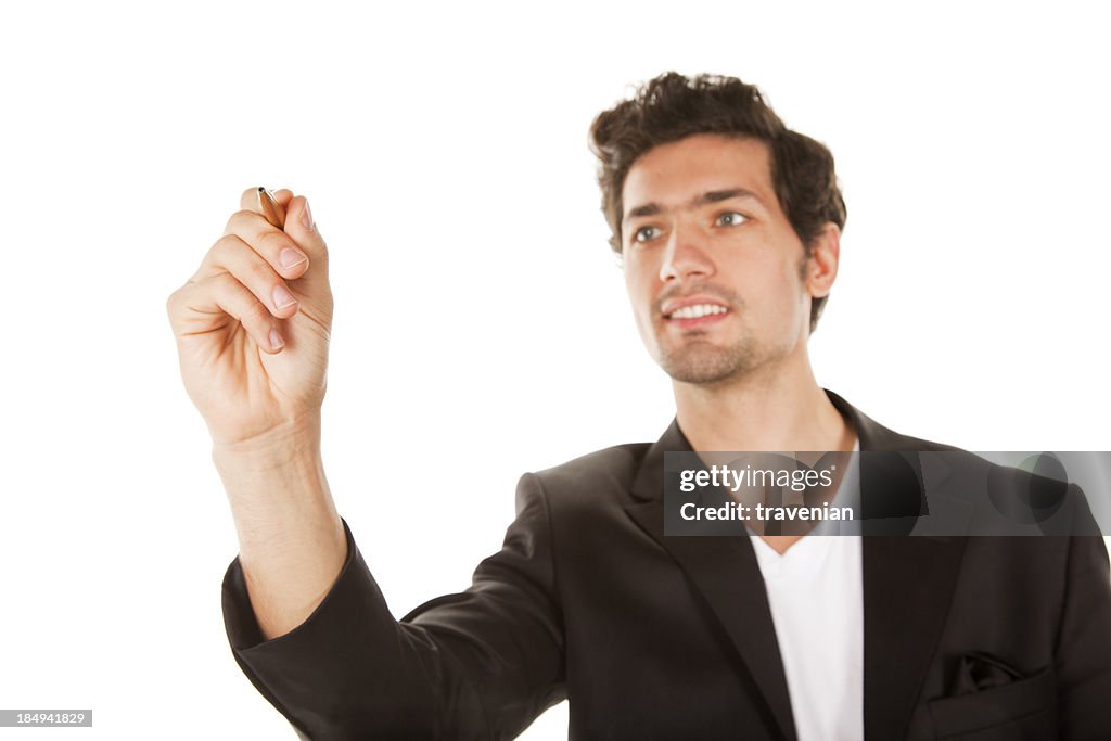 Businessman holding pen isolated on a white background,
