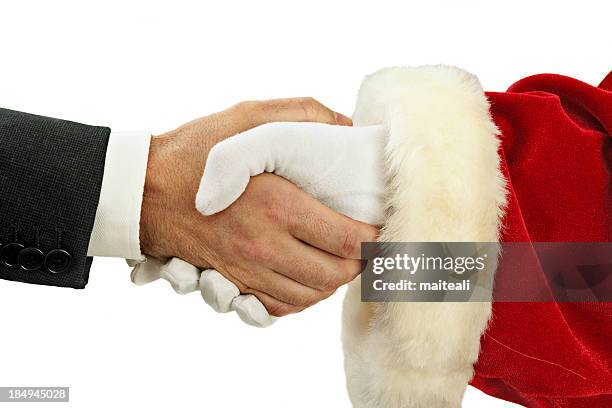 handshake with santa - santa suit stock pictures, royalty-free photos & images