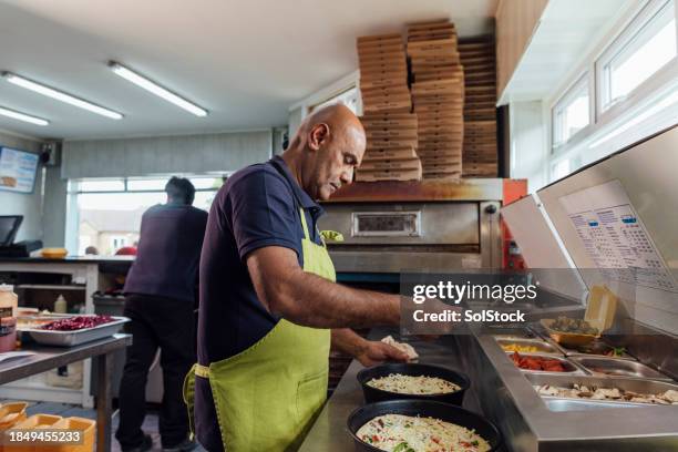 making pizzas in the kitchen - pizzeria stock pictures, royalty-free photos & images