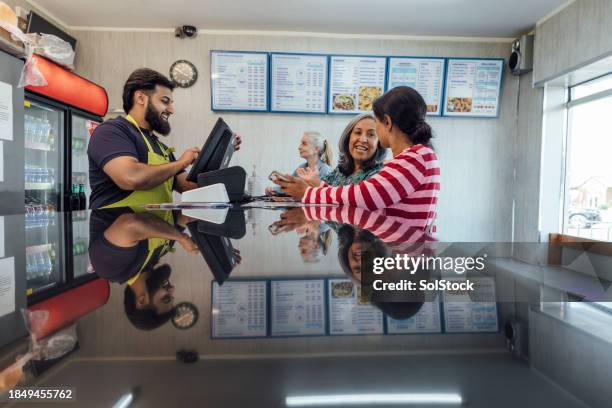 ordering food at a takeaway - persian restaurant stock pictures, royalty-free photos & images