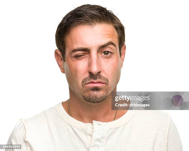 winking man raising one eyebrow - goatee stockfoto's en -beelden