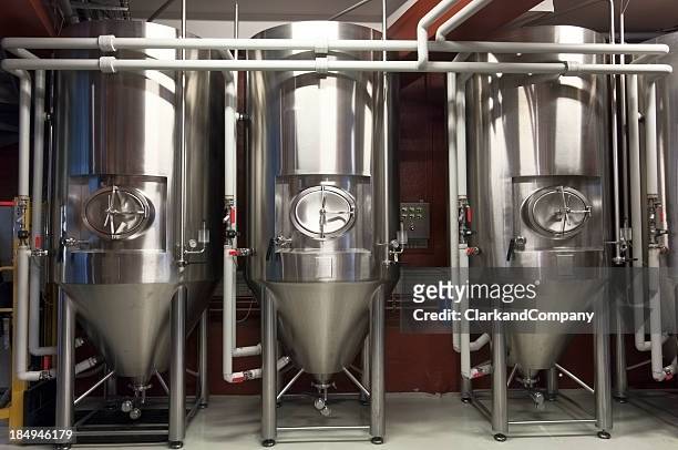 fermentation tanks in a micro brewery - brewery tank stock pictures, royalty-free photos & images