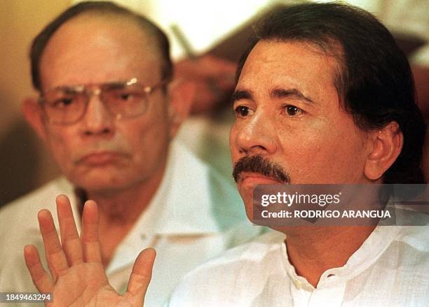 Former Nicaraguan President and opposition leader Daniel Ortega addresses a press conference 18 July in Managua, Nicaragua, as Tomas Borge ,...