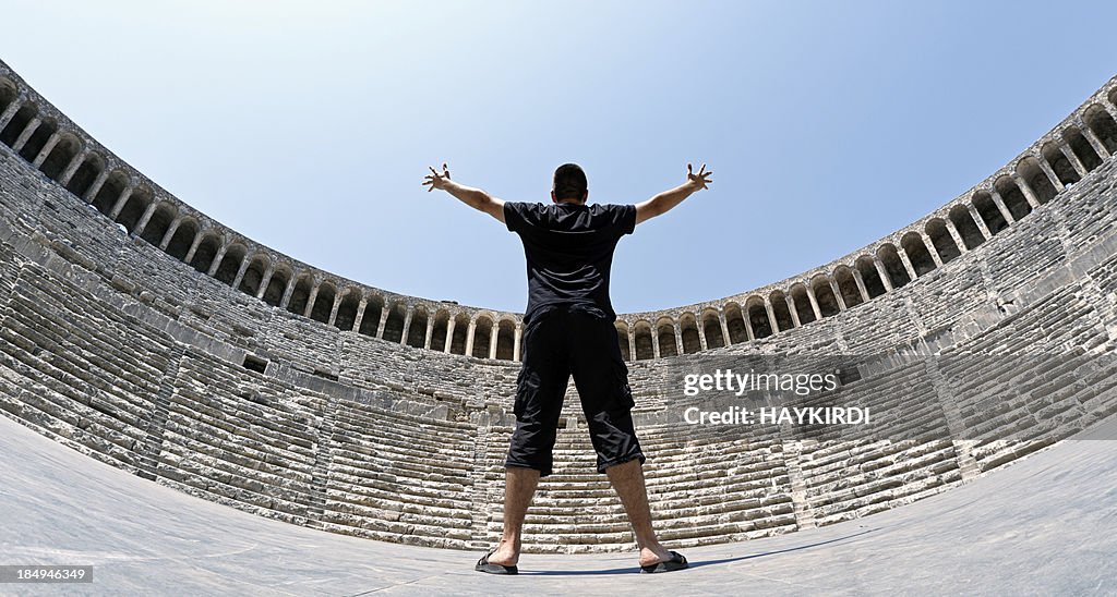 Actor saluting to Amphitheater
