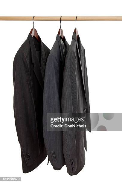 three suits on a rack - suit rack stock pictures, royalty-free photos & images