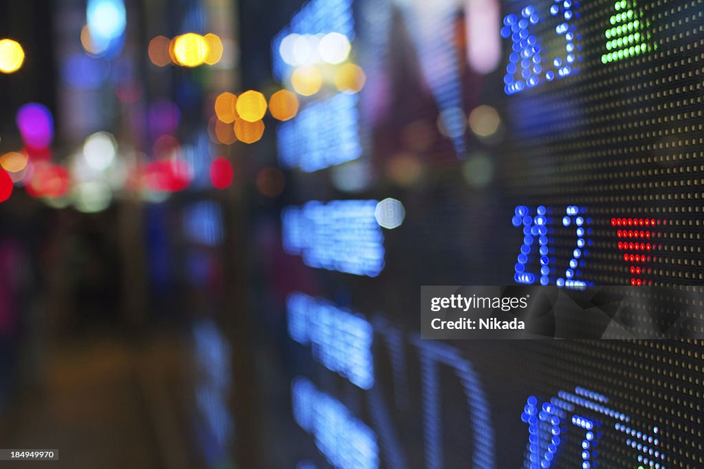 Stock market screen fading into blur