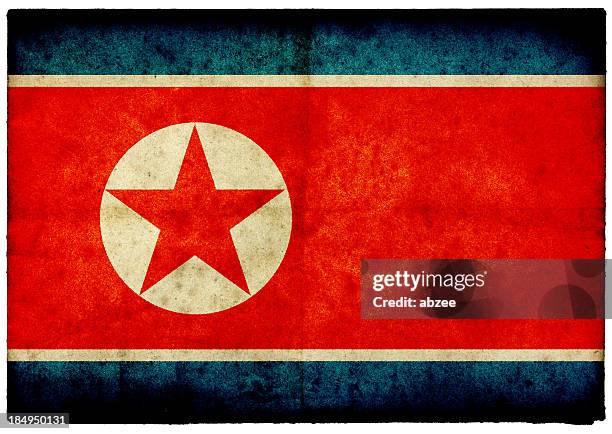 grunge north korean flag on rough edged old postcard - north korea flag stock pictures, royalty-free photos & images