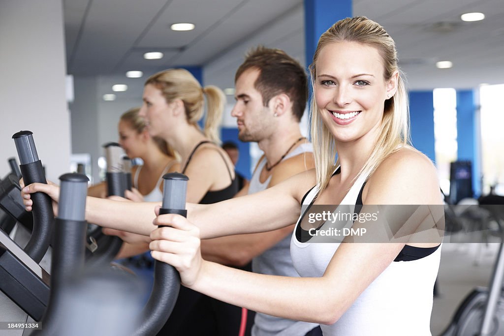 People Working Out on Elliptical Machines