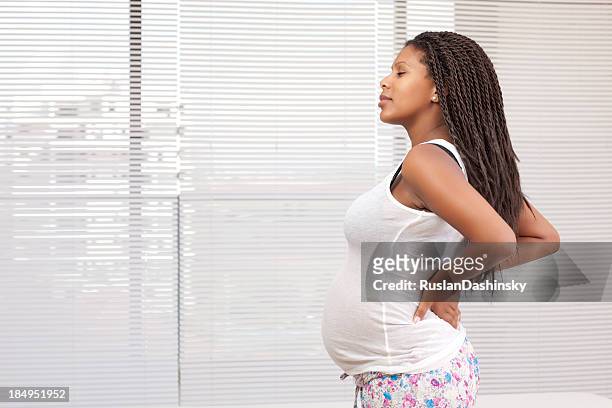 pregnancy backache. - woman waist up isolated stock pictures, royalty-free photos & images