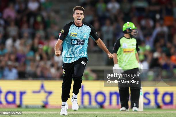 Xavier Bartlett of the Heat celebrates taking the final wicket of Tanveer Sangha of the Thunder during the BBL match between Sydney Thunder and...