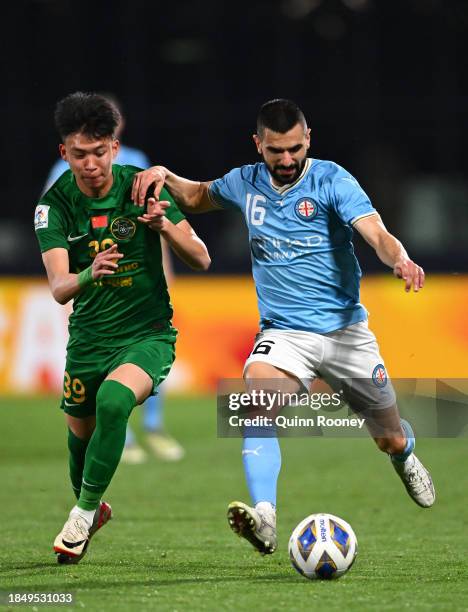 Aziz Behich of Melbourne City controls the ball infront of Wang Yudong of Zhejiang FC during the AFC Champions League Group H match between Melbourne...