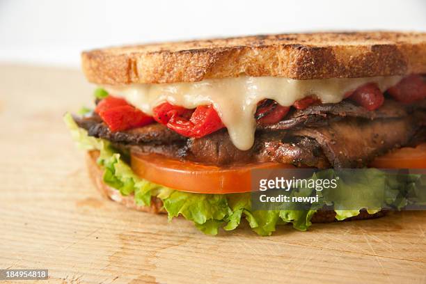 sliced roast beef sandwich - roast beef sandwich stock pictures, royalty-free photos & images