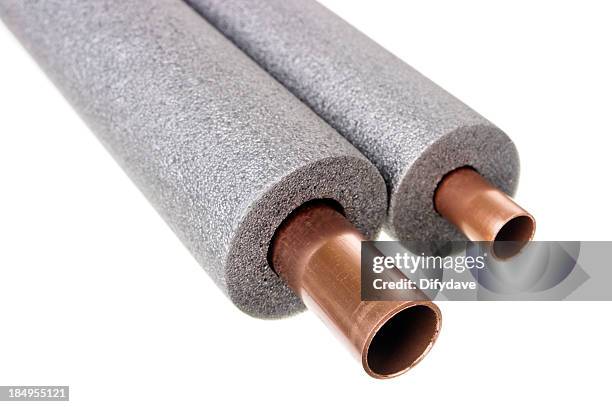 copper pipe with foam insulation - isoleren stockfoto's en -beelden