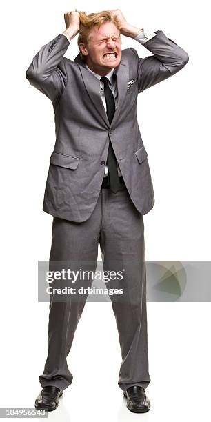 furious man in suit tearing out hair - pulling hair stock pictures, royalty-free photos & images