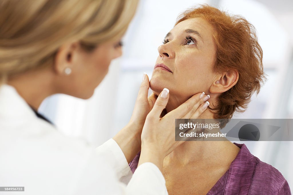 Female doctor examining her patient.