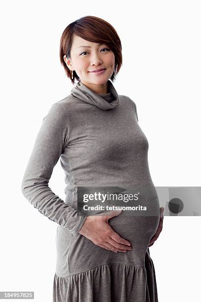 femme enceinte - asian pregnant woman white background photos et images de collection