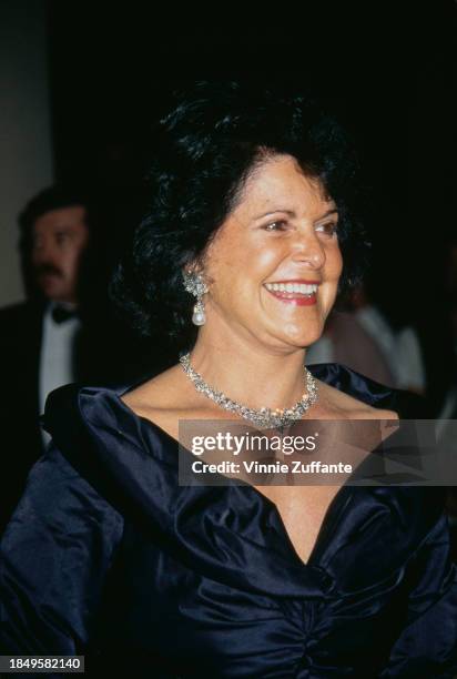 American businesswoman Jenny Craig, wearing a midnight blue evening gown with earrings and a necklace, attends the 10th Carousel of Hope Ball, held...