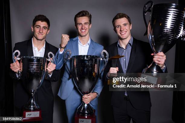 Theo Pourchaire of France and ART Grand Prix poses with the F2 Championship Winning Driver trophy, second placed driver Frederik Vesti of Denmark and...