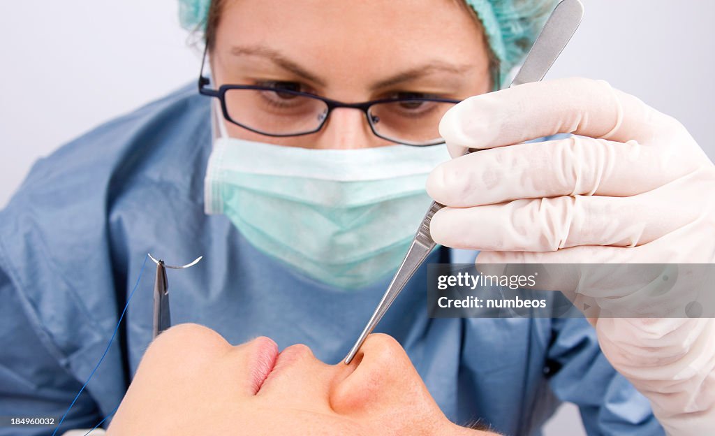 Doctor performing plastic surgery