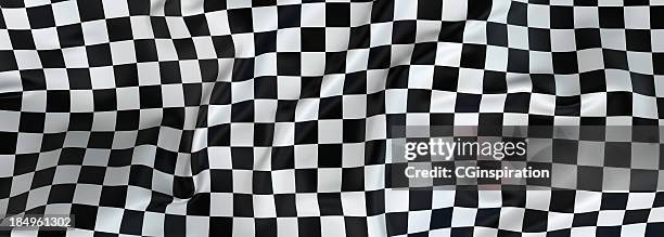 large checkered cloth fluttering in the wind - checkered flag stock pictures, royalty-free photos & images