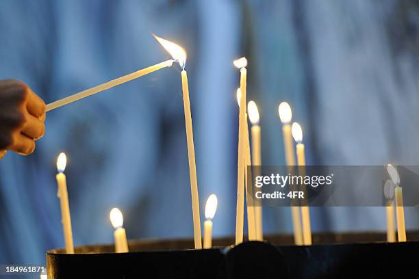 in memories - lighten a candle (xxxl) - lightning hands stock pictures, royalty-free photos & images