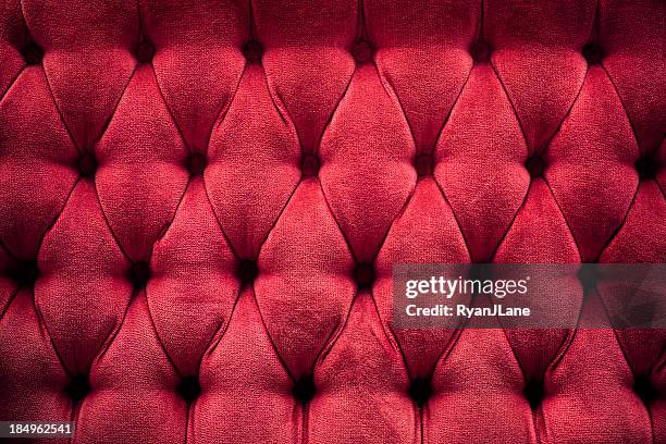 deep red quilted plush cushion - upholstry stockfoto's en -beelden