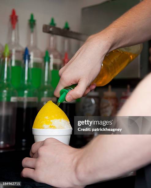 snow cone preparation - snow cones shaved ice stock pictures, royalty-free photos & images