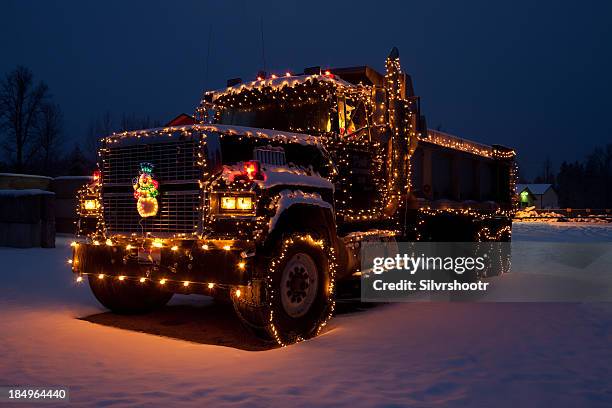 dumptruck outfitted christmas lights - christmas truck stock pictures, royalty-free photos & images