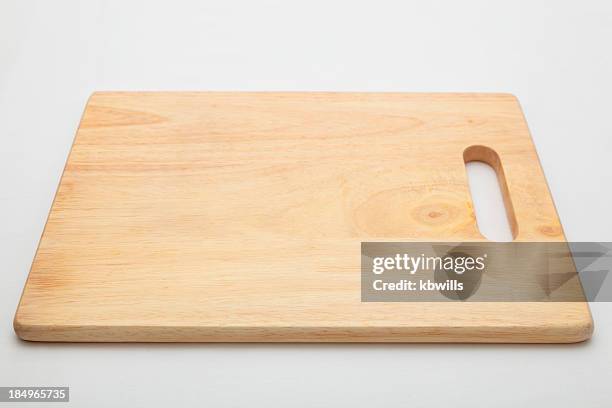 wooden chopping board with handle on continuous tone background - chopping stock pictures, royalty-free photos & images